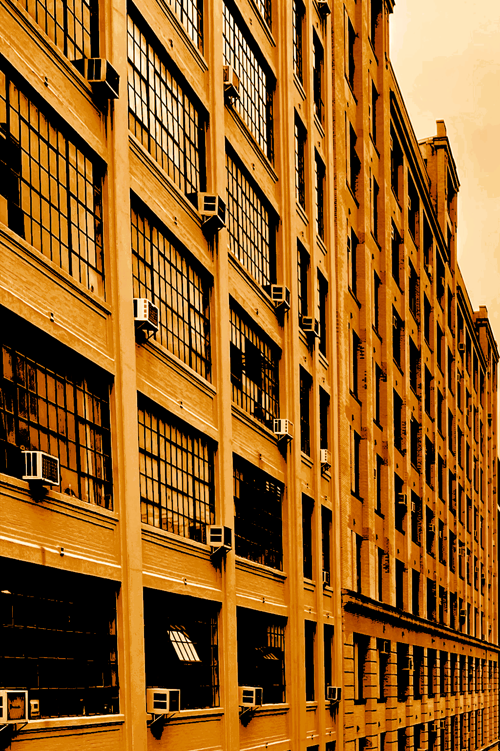 West Chelsea Building glowing with light at dusk